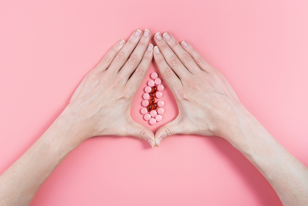 Abstract,Image,Of,Female,Genital,Organs,From,Hands,And,Pills.